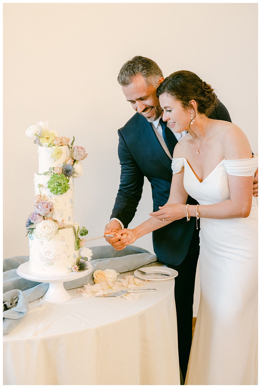 wedding cake, wedding bakery, bride and groom, cake cutting, wedding day, wedding florist, north carolina wedding photographer